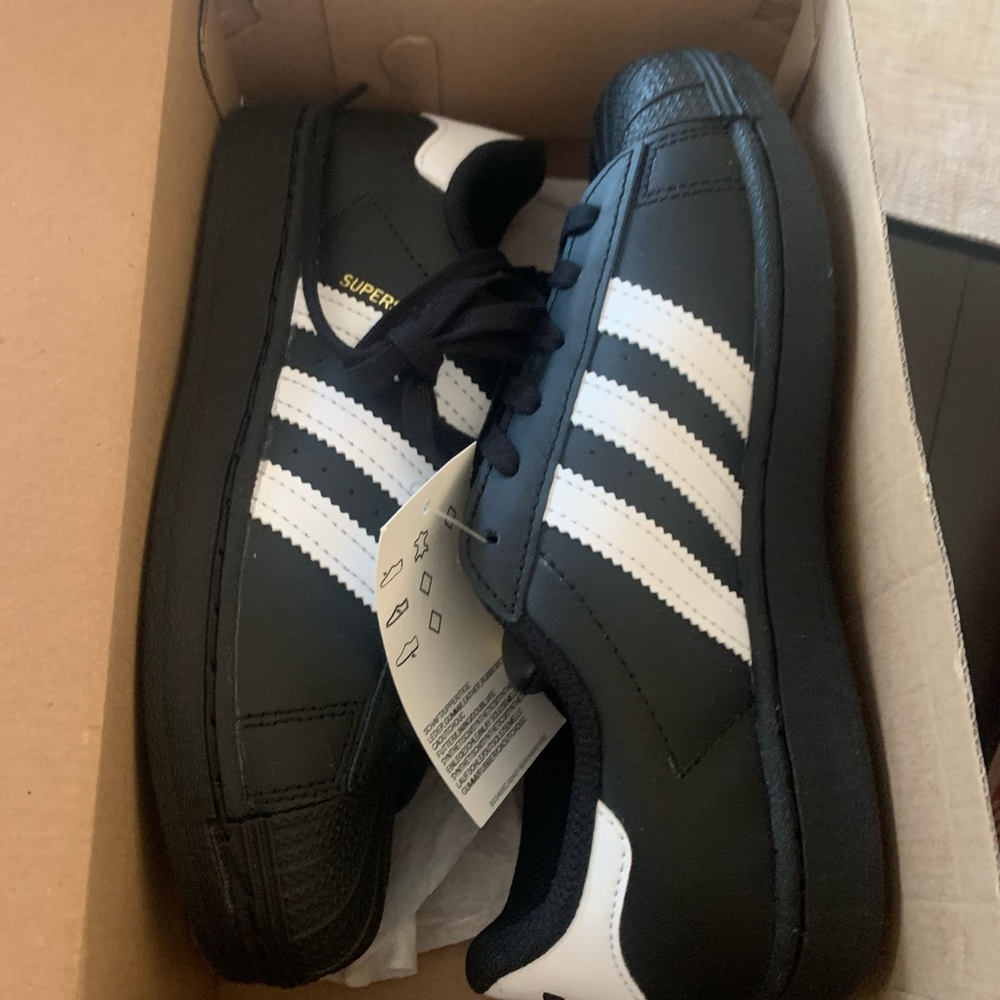 Brand new adidas boys shoes. Never taken out of the box
